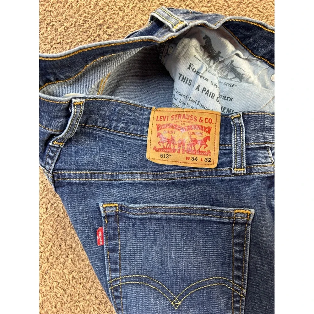 Levis 513 Slim Straight Jeans Mens 34x32 Medium Wash Blue Distressed Denim
